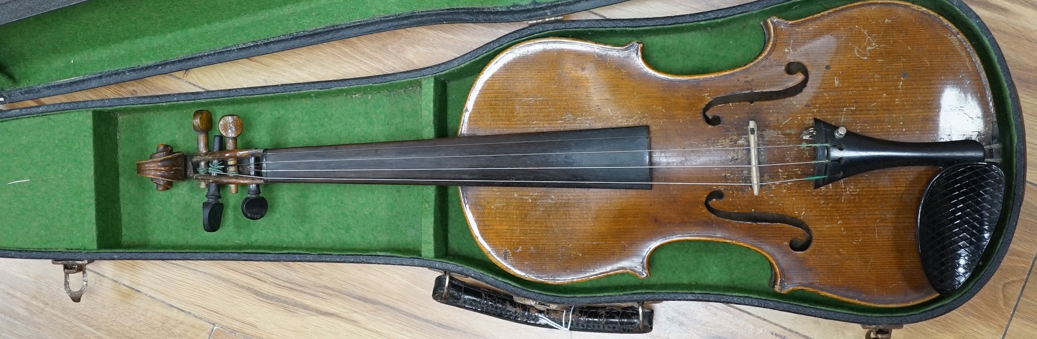 A cased late 19th century violin, back measures 36cm